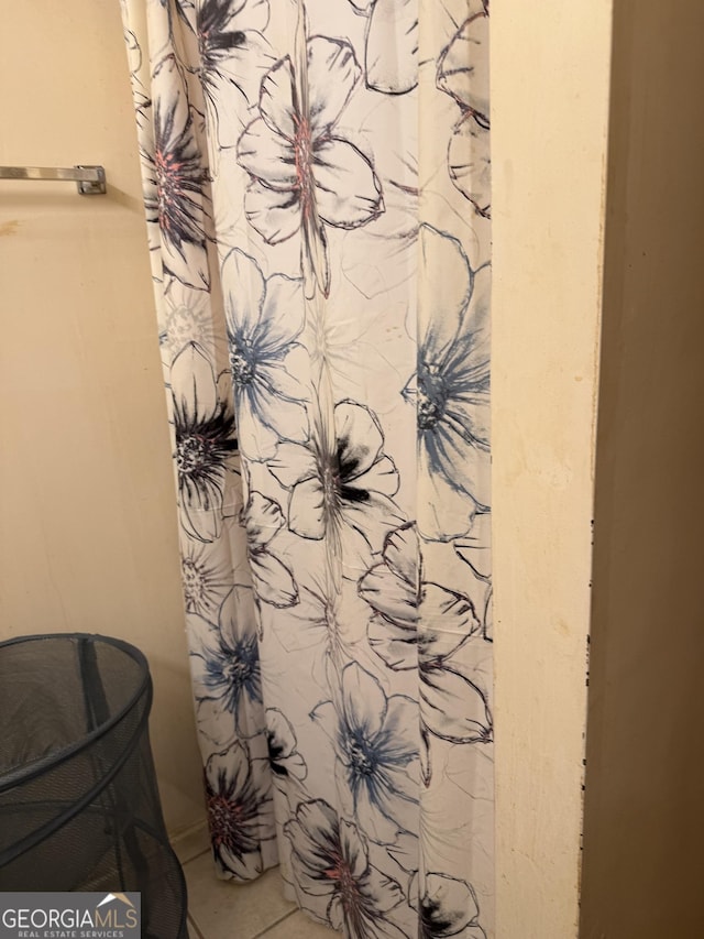 241 E Ash St, Social Circle, GA 30025 - bathroom featuring a shower with curtain and tile patterned flooring