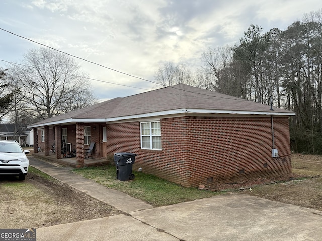 view of property exterior featuring a porch