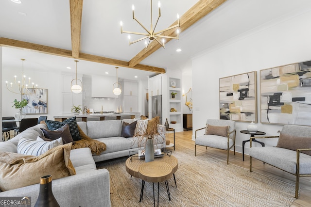 living room featuring beamed ceiling, a notable chandelier, and light hardwood / wood-style flooring