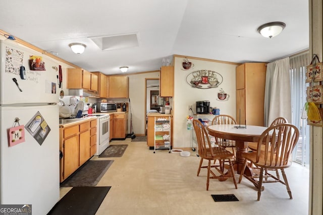 kitchen with light brown cabinetry, white appliances, vaulted ceiling, and ornamental molding