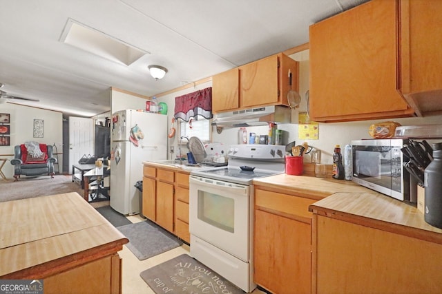 kitchen with sink and white appliances