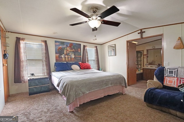 bedroom featuring crown molding, lofted ceiling, carpet floors, and multiple windows