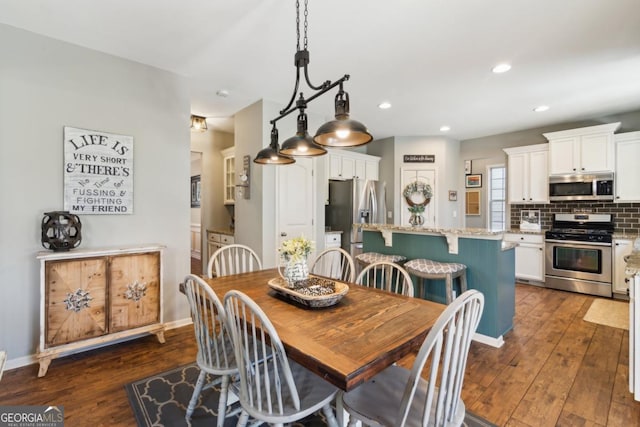 dining room featuring dark hardwood / wood-style flooring