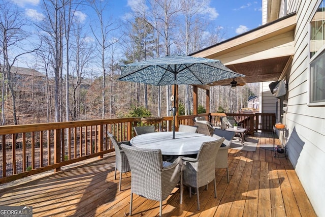 wooden terrace featuring ceiling fan