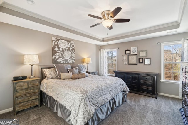 carpeted bedroom with multiple windows, ornamental molding, a raised ceiling, and ceiling fan