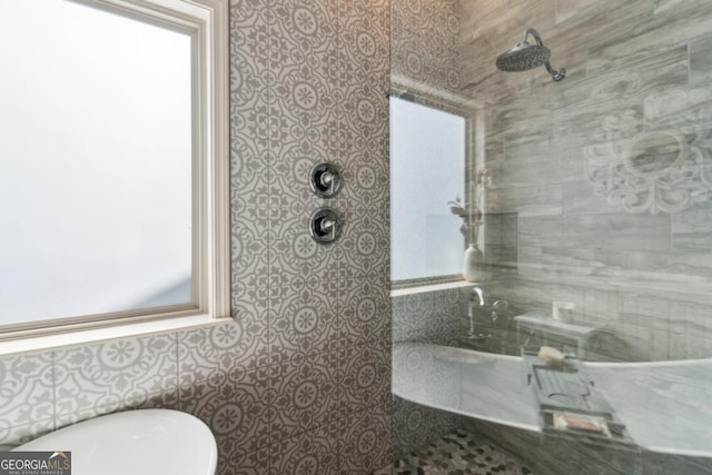 bathroom with tiled shower