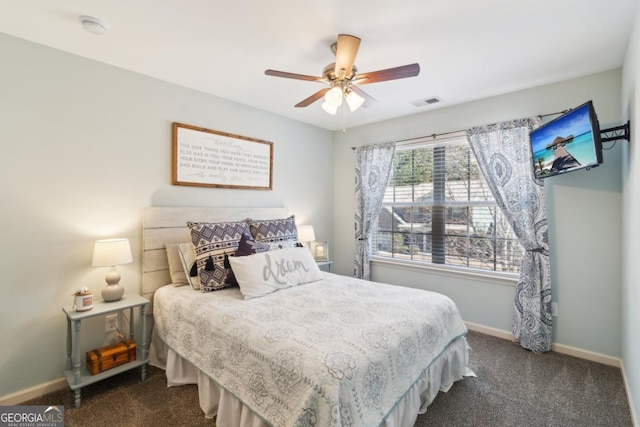 bedroom with dark colored carpet and ceiling fan