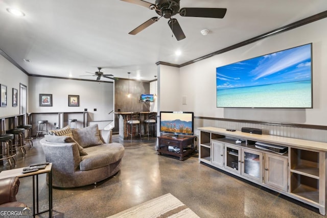 living room featuring crown molding, bar, and concrete floors