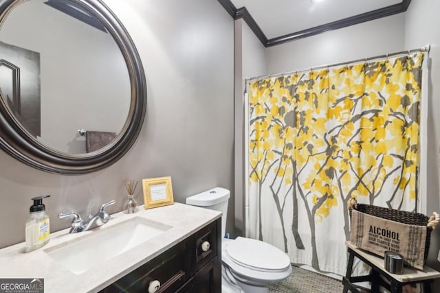 bathroom with vanity, crown molding, and toilet