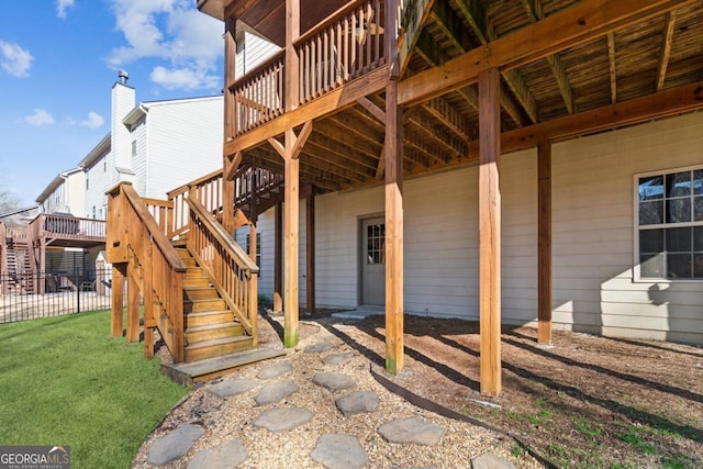 view of exterior entry with a deck