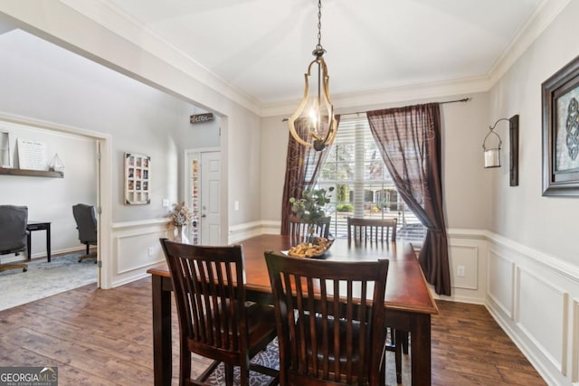 dining room featuring ornamental molding and dark hardwood / wood-style floors