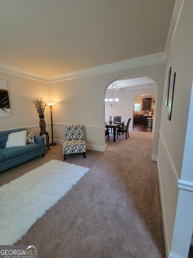 living room with ornamental molding and carpet flooring