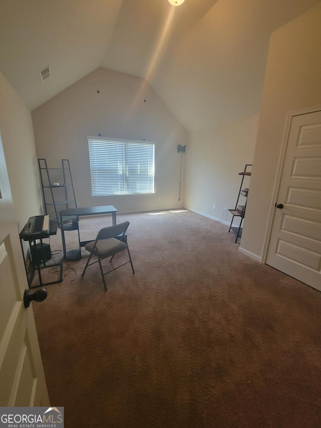 bonus room with vaulted ceiling and carpet floors