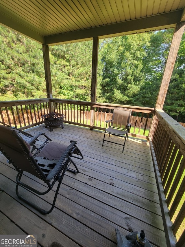 deck with an outdoor fire pit