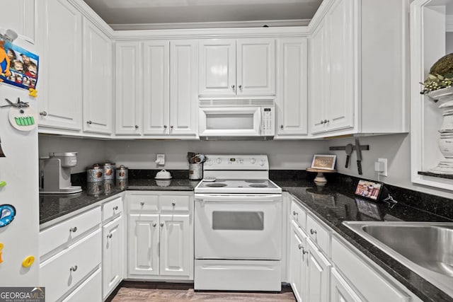 kitchen featuring white cabinetry, white appliances, and sink