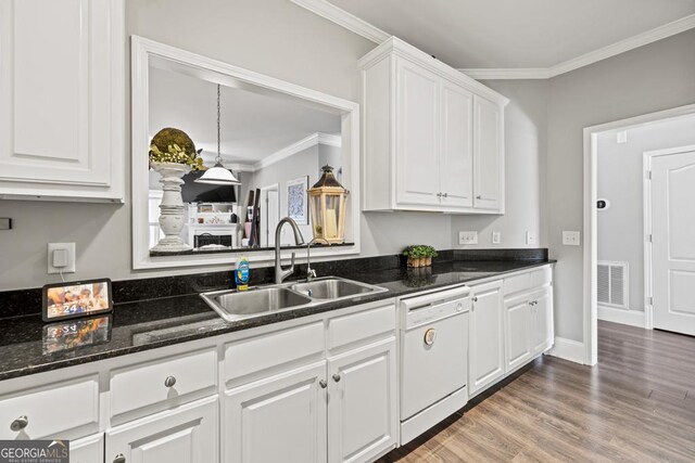 kitchen featuring white cabinetry, dishwasher, sink, and ornamental molding