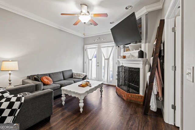 living room featuring crown molding, dark wood-type flooring, ceiling fan, and french doors