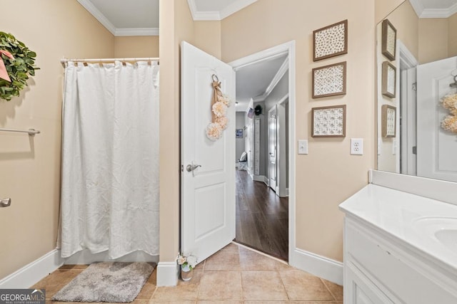 bathroom with tile patterned floors, vanity, a shower with shower curtain, and ornamental molding