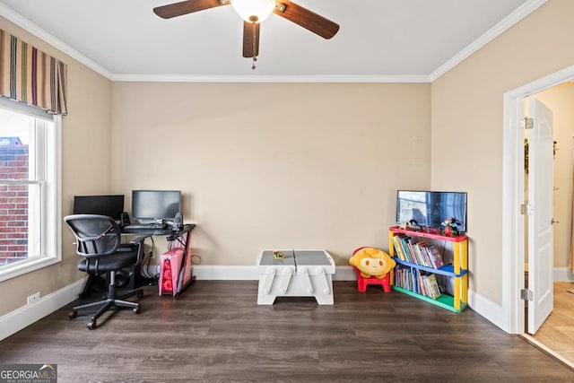 office space featuring crown molding, wood finished floors, baseboards, and ceiling fan