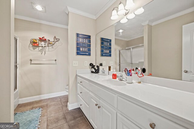 full bathroom featuring tile patterned flooring, enclosed tub / shower combo, vanity, toilet, and crown molding