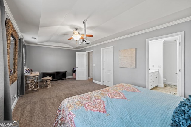 carpeted bedroom featuring visible vents, crown molding, baseboards, a raised ceiling, and a ceiling fan