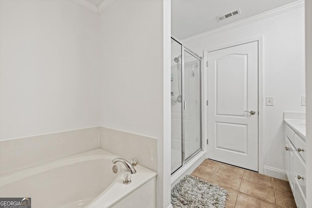 bathroom with crown molding, vanity, plus walk in shower, and tile patterned flooring