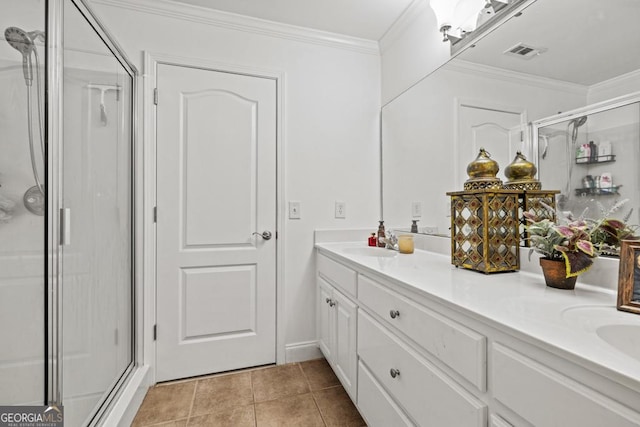 bathroom with visible vents, ornamental molding, a stall shower, and a sink