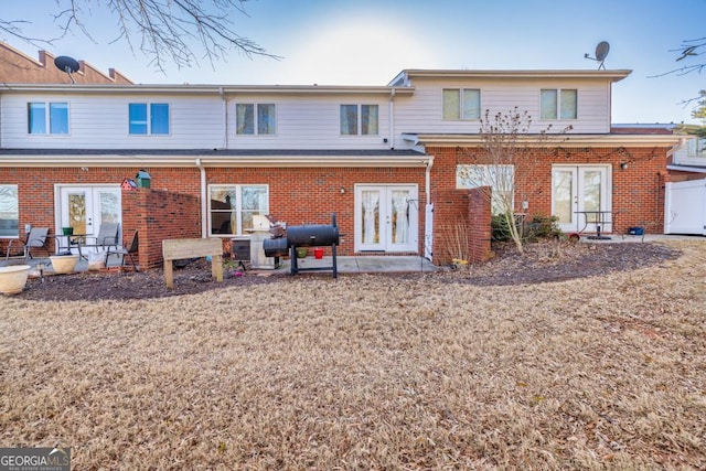 rear view of house featuring french doors