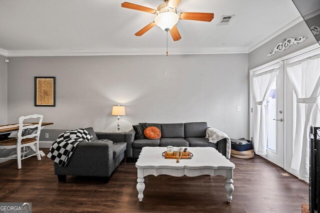 living room featuring ornamental molding, dark wood-type flooring, and ceiling fan