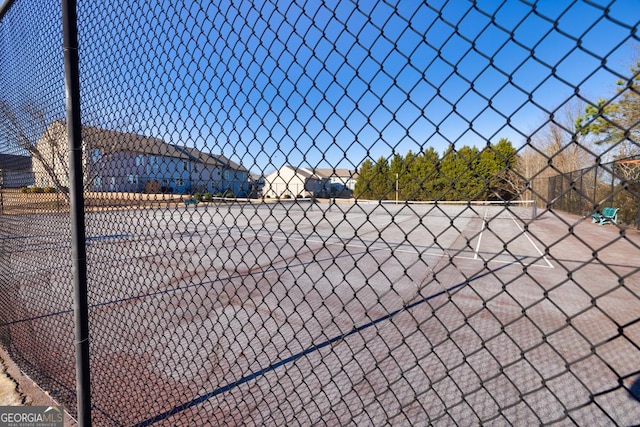 view of sport court with fence