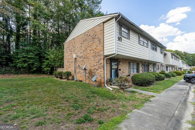 view of property exterior with a lawn