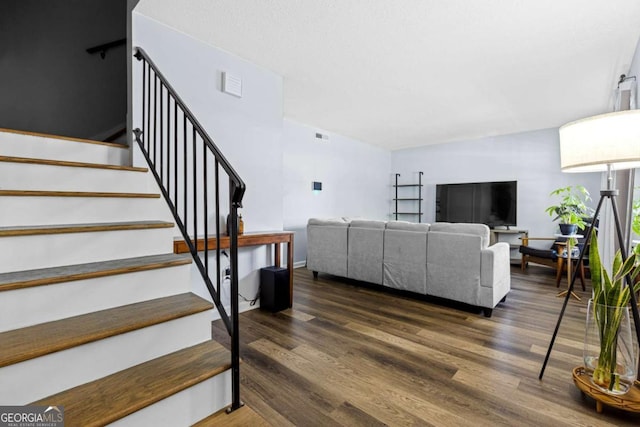 living room with dark hardwood / wood-style flooring