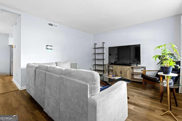 living room featuring dark hardwood / wood-style floors