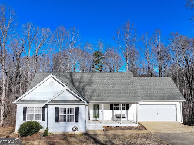 ranch-style home with a garage and covered porch