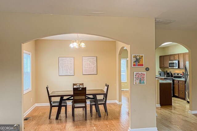 dining space featuring light hardwood / wood-style floors