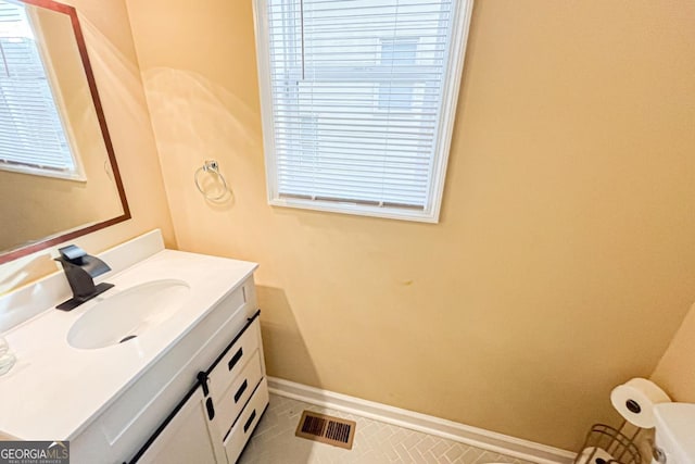 bathroom with vanity and tile patterned flooring