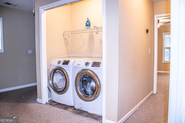 washroom with separate washer and dryer and carpet