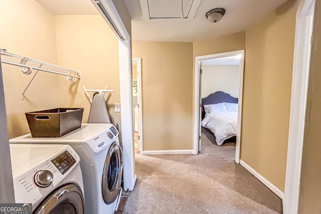 laundry area with washer and dryer and carpet flooring