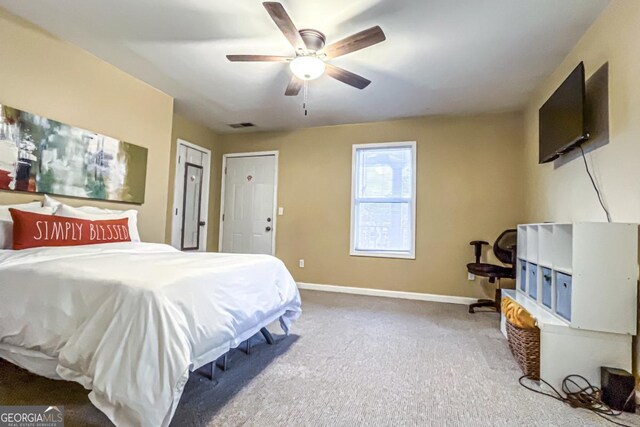 bedroom with ceiling fan and carpet