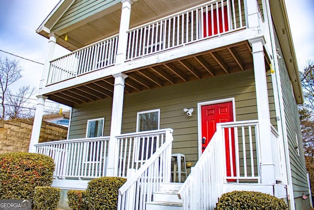 entrance to property featuring a balcony