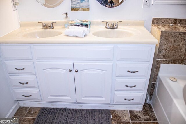 bathroom with vanity and a tub to relax in