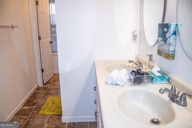 bathroom featuring tile patterned flooring and vanity