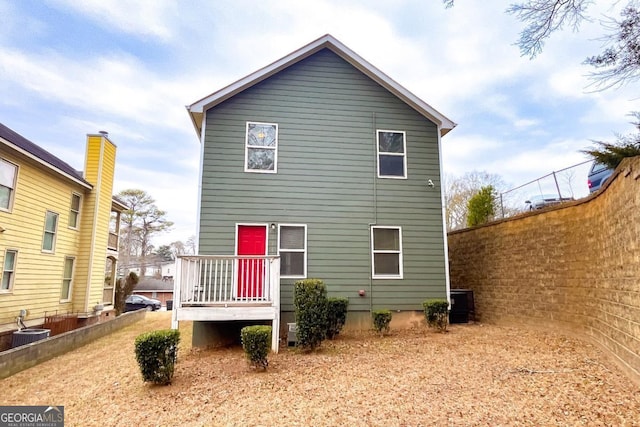 back of house with central AC