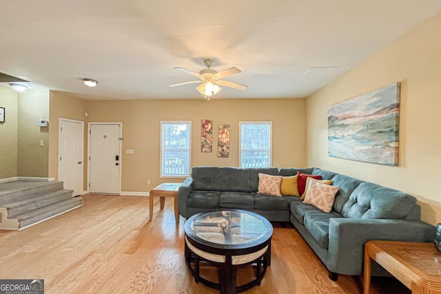 living room featuring ceiling fan and light wood-type flooring