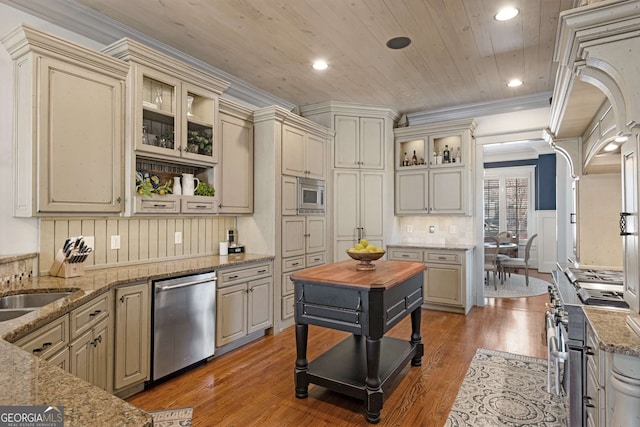 kitchen featuring hardwood / wood-style flooring, appliances with stainless steel finishes, ornamental molding, light stone countertops, and wooden ceiling