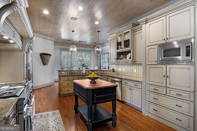 kitchen featuring crown molding, wooden counters, stainless steel appliances, a kitchen island, and decorative light fixtures