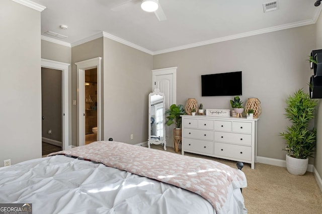 carpeted bedroom with ornamental molding and ceiling fan