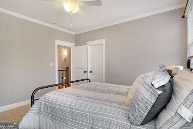 carpeted bedroom with crown molding and ceiling fan