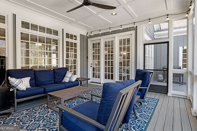 sunroom with coffered ceiling and ceiling fan