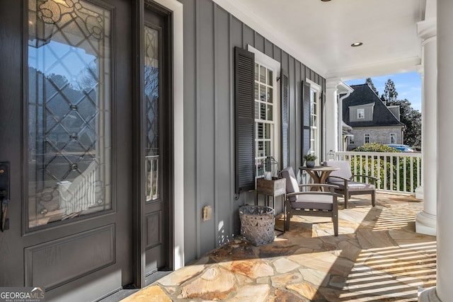 doorway to property featuring covered porch